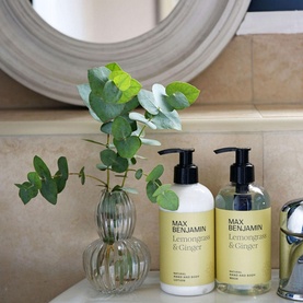 Max Benjamin Lemongrass & Ginger Natural Hand Wash 300ml in yellow pump bottles styled with eucalyptus stems on a marble surface