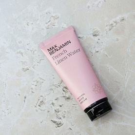 Max Benjamin Natural Hand Cream French Linen Water 75ml in a pink tube with black cap, on a marble surface