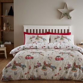 Catherine Lansfield Christmas Town Duvet Set in Natural, featuring a festive illustrated town scene with Christmas trees, cars and houses