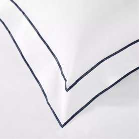 Karla Bree Rome Duvet Cover in white with navy double-stitch border detail, 100% cotton, 300 thread count, corner close-up view