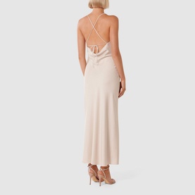 Model wearing Forever New Remy Tie-Back Satin Dress in cream, showing crossover tie-back straps and draped maxi skirt