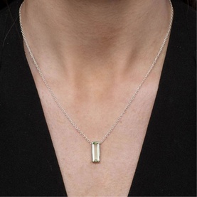 Model with Juvi Manhattan Rose Quartz Pendant Necklace in pink, rectangle-cut stone in sterling silver bezel setting on delicate chain