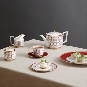 Wedgwood Renaissance Red Sugar & Creamer Two-Piece Set in white and red geometric pattern with gold trim, styled with matching teapot, cup and plates