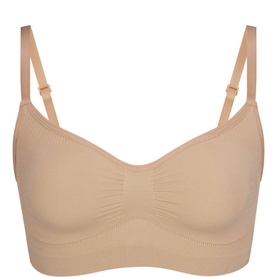 Skims Bralette Clay in beige, seamless construction with V-neckline, ruched centre detail and adjustable straps