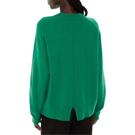 Model wearing Whistles Knit Sweater in green, showing rear view with centre back seam detail and ribbed hem, long raglan sleeves