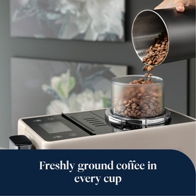 Delonghi Rivelia Automatic Compact Bean To Cup in beige, with coffee beans being poured into the transparent hopper