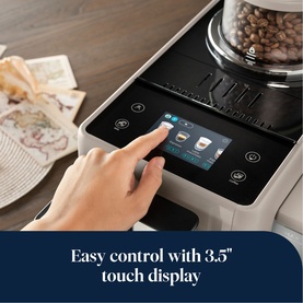 Delonghi Rivelia Automatic Compact Bean To Cup in beige, finger tapping 3.5-inch touch display showing coffee menu options