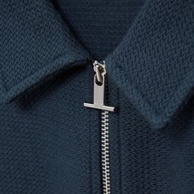Reiss Felix Half-Zip Polo Shirt in blue, close-up of silver-tone half-zip fastening and textured knit collar detail