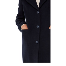 Model wearing Whistles Amalia Single-Breasted Coat in blue with notched lapels, button fastening and patch pockets