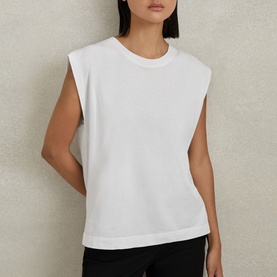 Model wearing Reiss Morgan Solid T-Shirt in white, featuring round neckline and cap sleeves in a relaxed cotton fit
