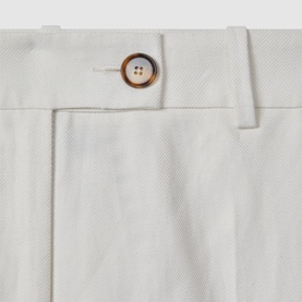 Reiss Lori High-Rise Wide-Leg Trousers in white, close-up of mottled button and fly fastening with belt loop detail