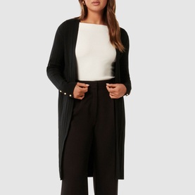 Model wearing Forever New Daphne Ribbed Cardigan in black, longline open-front style with pearl buttons