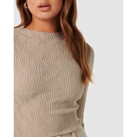 Model wearing Forever New Everley Wave Top in beige, featuring wave-texture knit and long sleeves, close-up crop view