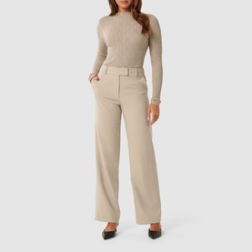 Model wearing Forever New Everley Wave Top in beige with mock neckline and long sleeves, styled with matching wide-leg trousers