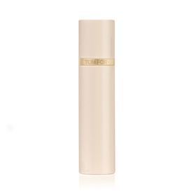 Tom Ford travel-size fragrance atomiser in pale blush pink with gold band logo detail