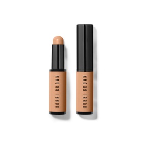 Bobbi Brown Skin Corrector Stick concealer in Dark Bisque, 3g, shown open and capped in warm beige tone