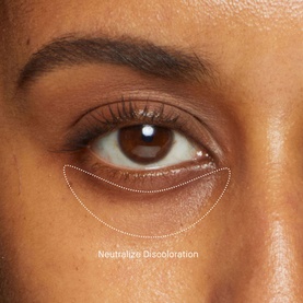 Close-up of under-eye area showing Bobbi Brown Skin Corrector Stick in Dark Bisque applied beneath the eye, with Neutralize Discoloration annotation