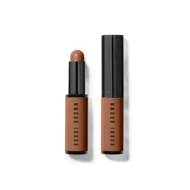 Bobbi Brown Skin Corrector Stick concealer in Very Deep Bisque, 3g, shown open and capped in warm brown-toned stick format