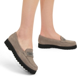 Model wearing Carvela Comfort Essence Embellished Loafers in brown suede with gunmetal stud strap detail and black contrast sole