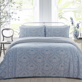 Appletree Alexia Duvet Set in blue, featuring a damask-inspired print with ornate detailing, styled on a bed with matching Oxford pillowcases