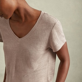 Model wearing Reiss Lottie Marled Solid T-Shirt in pink, showing V-neckline and short sleeves in lightweight marled linen fabrication