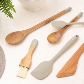 Mary Berry Wooden Spoon 24cm in brown acacia wood, shown alongside matching spatula, pastry brush, and stirring spoon with sage silicone tips