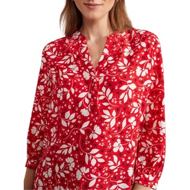 Model wearing Hobbs Essie Floral Blouse in red and white floral print, featuring mandarin collar, half button placket and three-quarter sleeves