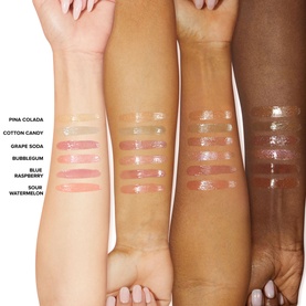Too Faced Kissing Jelly Lip Oil Gloss swatches in seven shades including Grape Soda shown across four skin tones