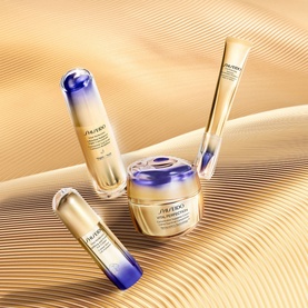 Shiseido Concentrated Supreme Cream Jar & Refill Duo skincare set with serum and eye cream, arranged on golden sand dunes