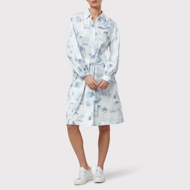 Model wearing Helen McAlinden Odette Toile de Jouy Shirt Dress in blue with collar, tie waist and long sleeves, styled with white trainers