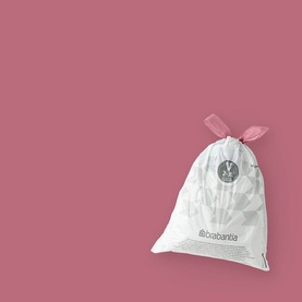 Brabantia PerfectFit Bin Bags in white with pink drawstring tie, shown against a dusky pink background