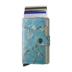Secrid Floral Mini Wallet in blue leather with almond blossom print, aluminium card protector with slide-out mechanism and button fastening