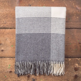 Foxford The Downpatrick Throw XL in navy and cream herringbone and check pattern with rolled fringe trims, folded flat