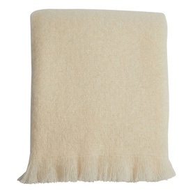 Foxford Off-White Mohair Throw with cut fringe trim, folded flat, in a soft cream tone. 75% mohair blend