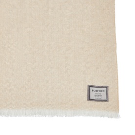 Foxford Extra Large Lambswool Throw in camel, herringbone weave with self-fringed trim and woven logo badge detail