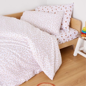 Foxford 200 Thread Count Fauna Pillowcase in white cotton with delicate leaf print, styled on a children's bed with matching duvet cover
