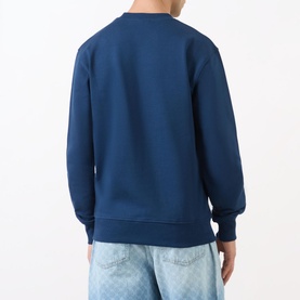 Model wearing Daily Paper Scratch Logo Sweatshirt in blue, crew neck, ribbed trims, back view, styled with light wash jeans