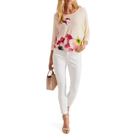 Model wearing Phase Eight Erika Placement Floral Sweater in multi, with white cropped trousers and nude heeled sandals, carrying a nude bag