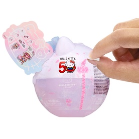 LOL Surprise Loves Hello Kitty Tots Doll in pink and blue Hello Kitty 50th anniversary capsule ball, shown being opened