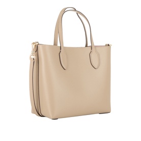 Kate Spade Bleecker Medium Leather Crossbody Bag in taupe with dual top handles, gold-tone hardware, and detachable crossbody strap