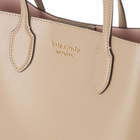 Kate Spade Bleecker Medium Leather Crossbody Bag in taupe with gold-tone logo lettering, dual top handles and smooth leather finish