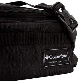 Columbia Zigzag Bum Bag in black, close-up showing logo patch, zip compartments and adjustable strap with black hardware