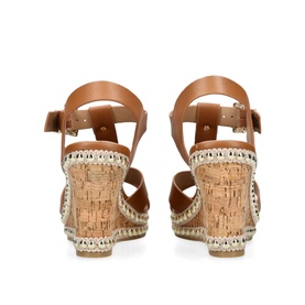 Carvela Super Stud Wedges in beige synthetic leather, rear view showing adjustable ankle strap, buckle fastening