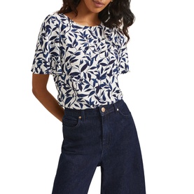 Model wearing Phase Eight Nayana Leaf Print Blouse in blue, all-over leaf print, short flutter sleeves, round neck, styled with dark wide-leg jeans