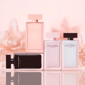 Narciso Rodriguez Musc Nude for Her EDP collection displayed together, featuring four bottles in blush pink and black tones against a soft floral