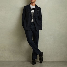 Model wearing Reiss Lory Striped T-Shirt in white with navy stripe, styled with navy suit and black shoes