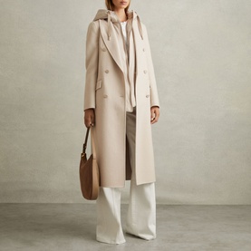 Model wearing Reiss Maeve Double-Breasted Trench Coat in beige, longline wool-blend with peak lapels