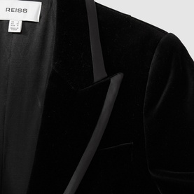 Reiss Parisa Single-Breasted Velvet Blazer in black, close-up of satin peak lapels and velvet texture detail