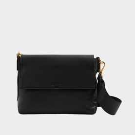 Reiss Selena Logo Crossbody Bag in black grained leather with flap fastening, gold-tone hardware, and wide adjustable crossbody strap