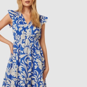Model wearing Forever New Florence Floral Dress in blue with white floral print, V-neckline, frill sleeves, and gathered waist